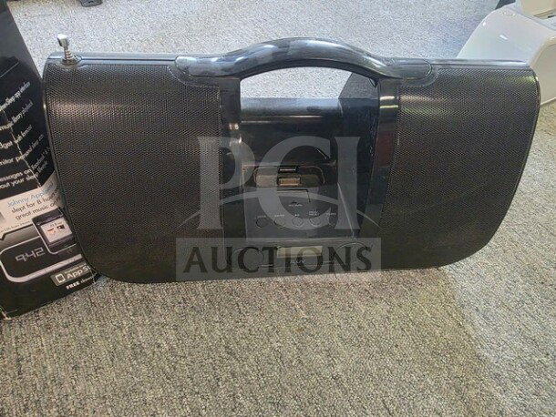Lot with iHome and iLuv player, black, unknown working condition, sold as is. Features speaker, dock, controls.