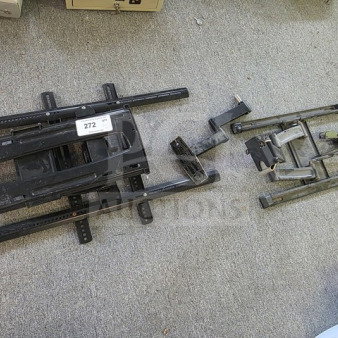Lot of miscellaneous TV wall mounts on display, includes various sizes and styles. Visible tag numbered 272.