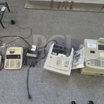 Lot of miscellaneous printing calculators and cash registers, various models and brands. Includes visible cords and paper rolls.