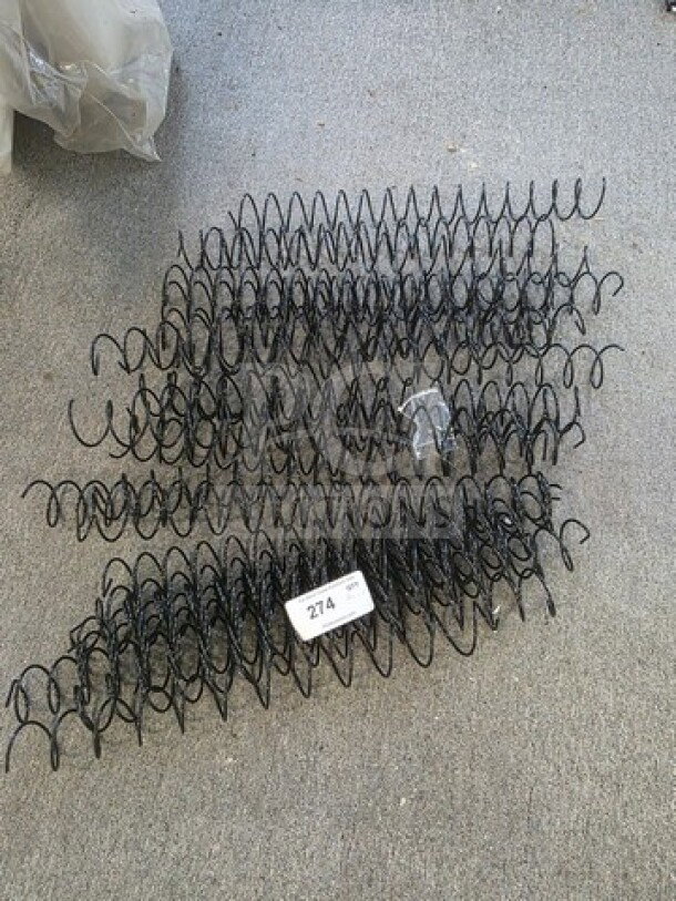 Lot of black wire spiral coils in good condition, displayed on a gray surface. Auction tag reads "274."