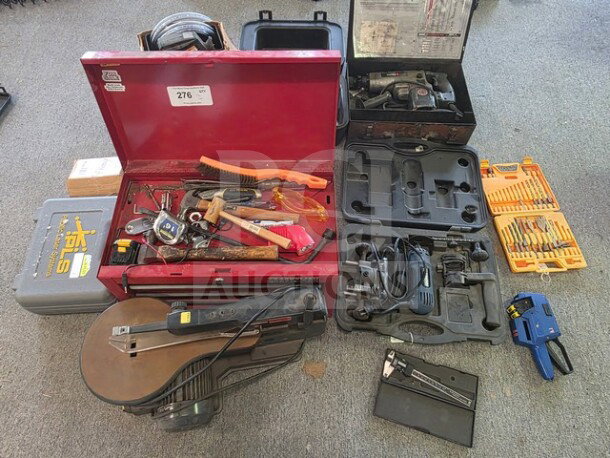 One lot of miscellaneous tools including a red toolbox, hand tools, power tool cases, and drill bits, sold as is.