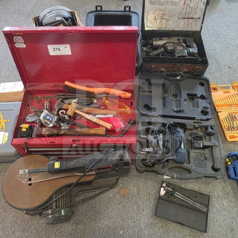 One lot of miscellaneous tools including a red toolbox, hand tools, power tool cases, and drill bits, sold as is.