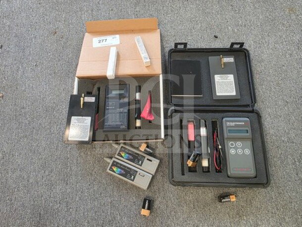 Lot of miscellaneous gold testers, various brands, featured in open cases. Sold as is, untested condition.