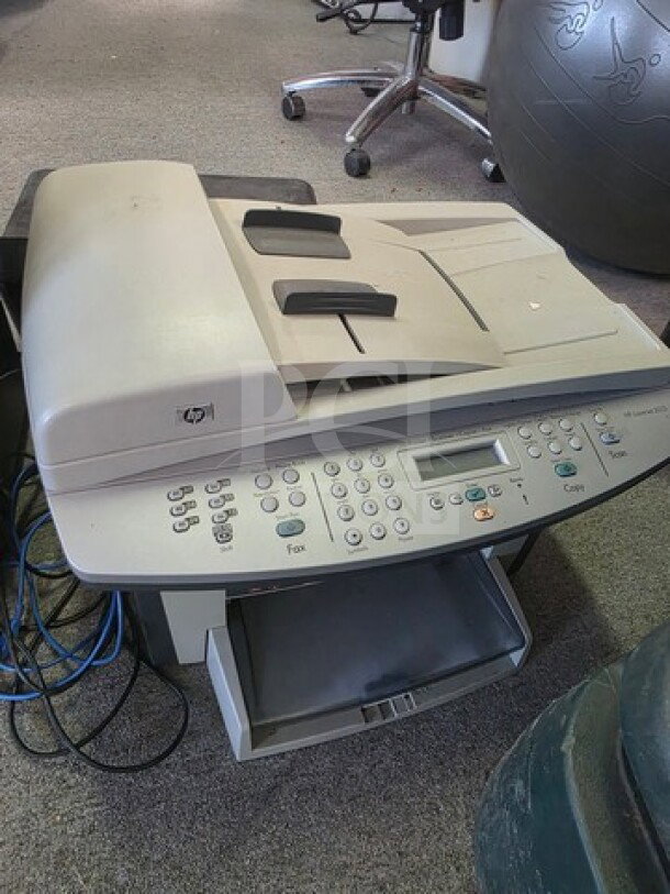 HP fax machine with keypad and display, beige color, used condition, part of auction lot with printer and shredder.