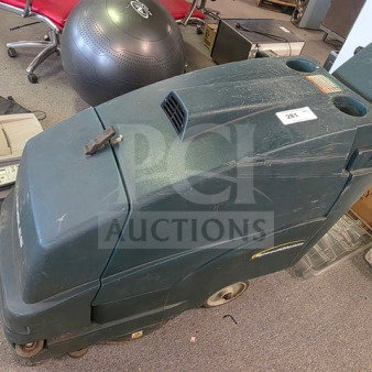 Tennant Nobles SpeedGleam walk-behind floor scrubber, dark green, used condition, model tag visible, serial number 281.