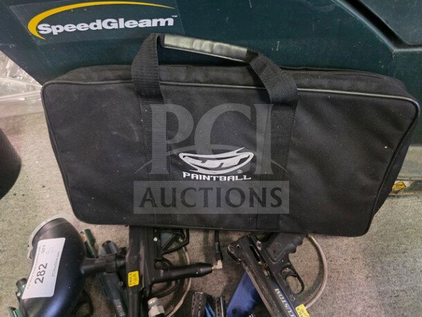 Lot of miscellaneous paintball markers with a black Paintball brand case. Includes multiple markers with visible wear.