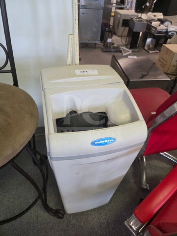 Water Boss Water Softener, gray, free-standing unit in used condition. Blue logo tag visible on the front.