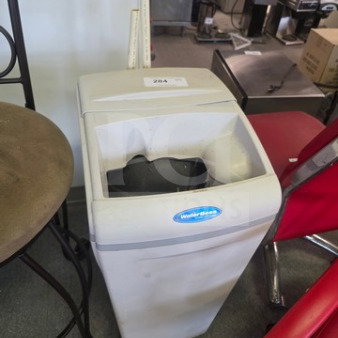 Water Boss Water Softener, gray, free-standing unit in used condition. Blue logo tag visible on the front.