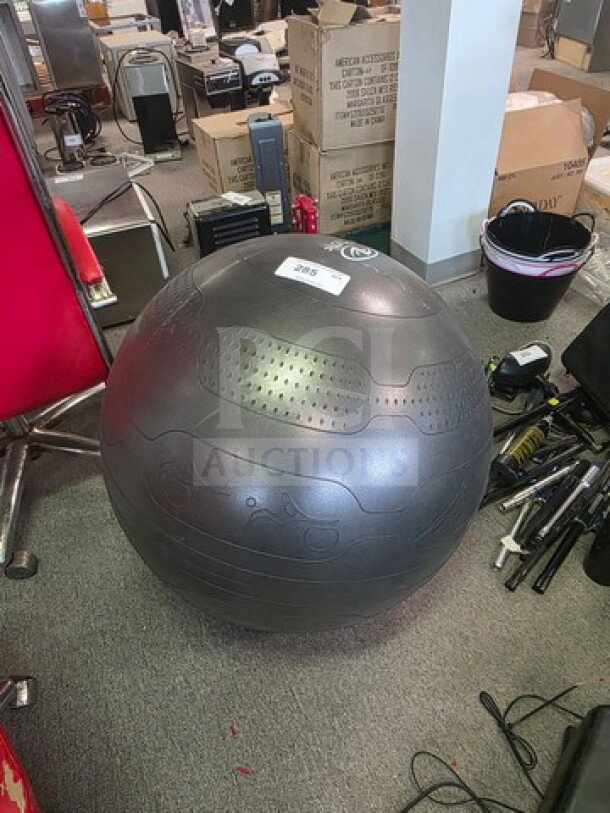 Black yoga ball with textured surface, good condition. Item tag indicates "2965." Suitable for fitness and exercise.