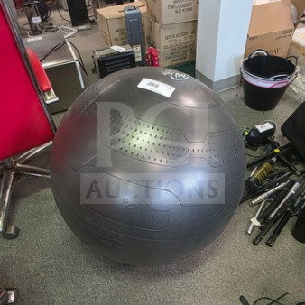 Black yoga ball with textured surface, good condition. Item tag indicates "2965." Suitable for fitness and exercise.