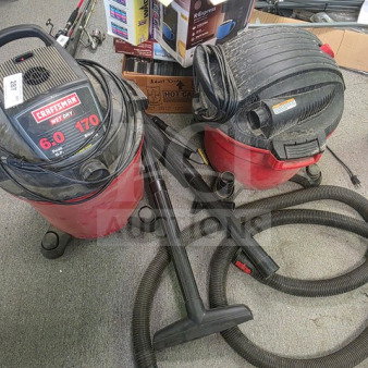 Two Craftsman wet/dry Shop Vacs, model numbers 6.0 and 170, with attachments, red and black, used condition.