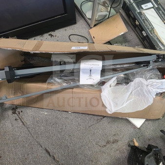 Climbing machine in original packaging, partially assembled, with a visible tag labeled "Climbing Machine," appears unused.