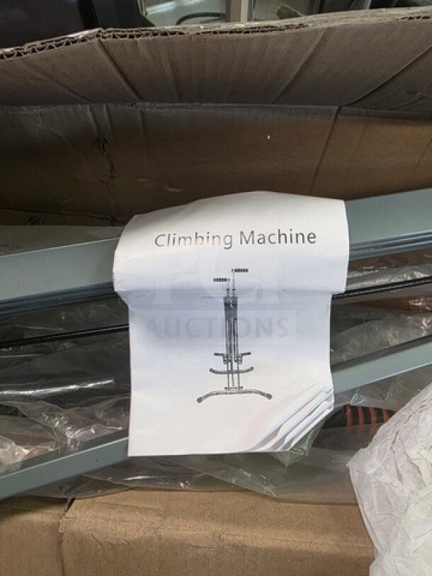 Climbing machine in packaging, new condition, includes assembly instructions.