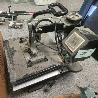 Industrial heat press machine with digital display, showing some wear. Control panel details temperature settings. Auction tag indicates lot 290.