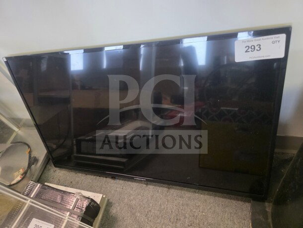 Element flat screen TV, unknown working condition, sold as is. Auction tag labeled "293".