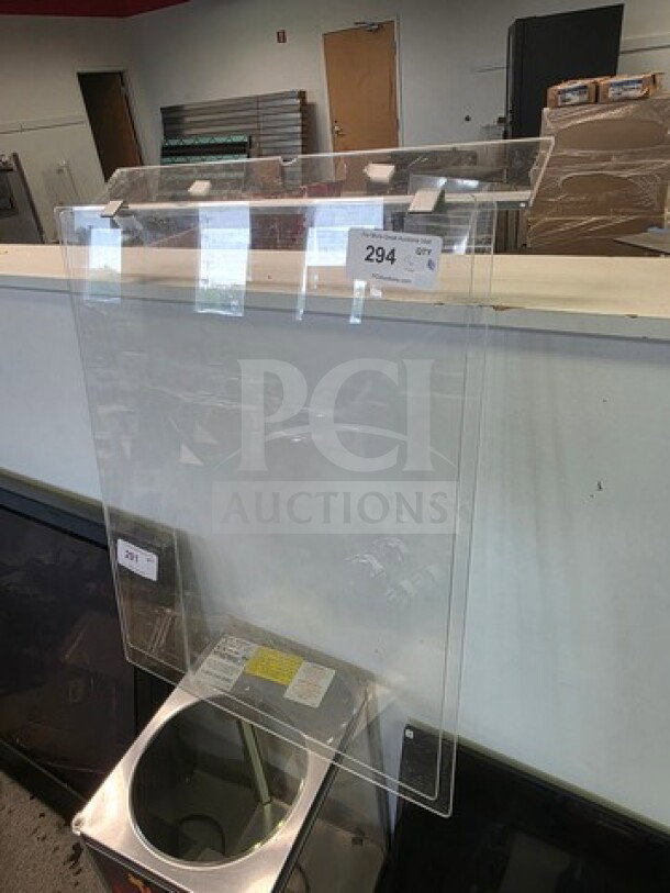 Clear acrylic sneeze guards in lot with mounting brackets, visible label "294", excellent condition.