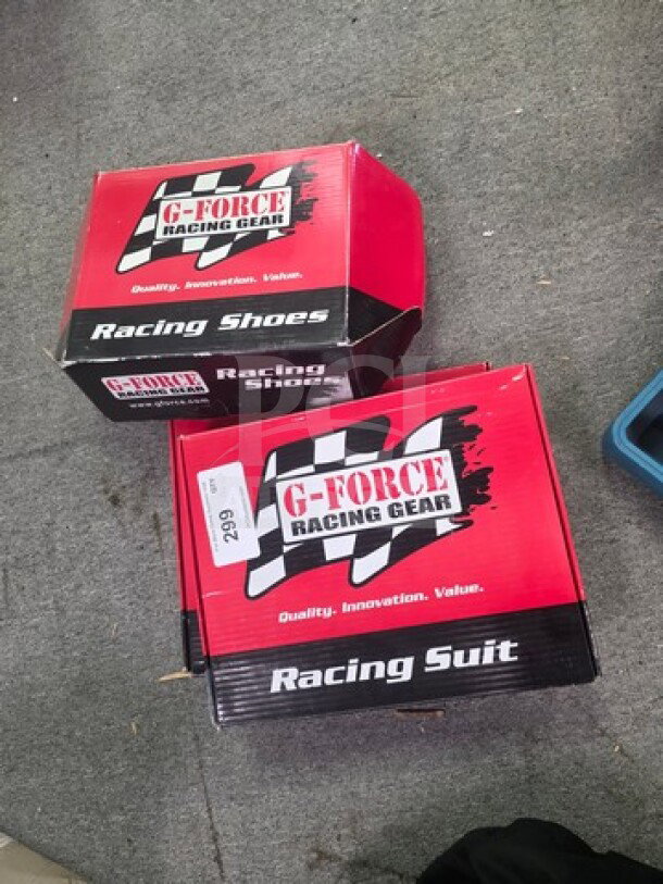 Boxes of G-Force Racing Gear, including a racing suit and shoes. Boxes labeled with "Quality, Innovation, Value."