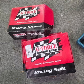 Boxes of G-Force Racing Gear, including a racing suit and shoes. Boxes labeled with "Quality, Innovation, Value."