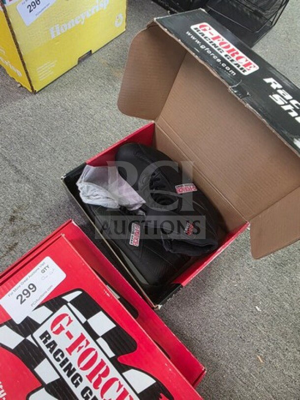 One lot with G-Force Racing Suits and black G-Force Racing Shoes in box, tag indicates lot number 299.