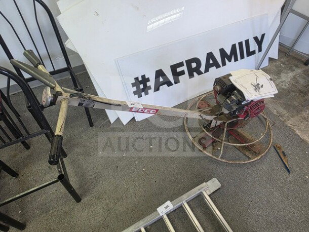 EDCO Power Trowel in unknown working condition, sold as is. Features metal frame, handles, and visible EDCO branding.