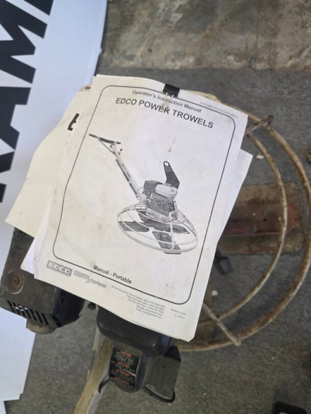 EDCO Power Trowel, unknown working condition, includes operator's manual. Sold as is.