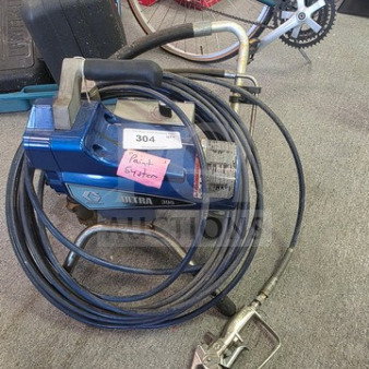 Graco Ultra 395 Paint Sprayer, blue, with hose and spray gun, used condition, "Paint Sprayer" tag attached.