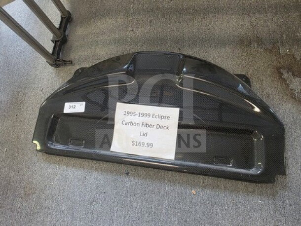 1995-1999 Eclipse carbon fiber deck lid, excellent condition, textured finish; price tag reads $169.99.