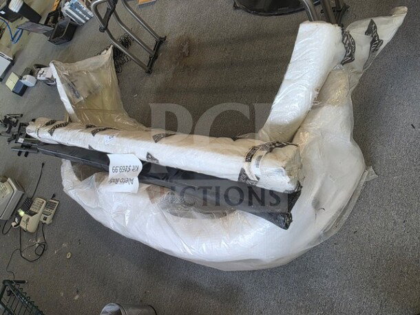 Alero Body Kit wrapped in protective material, includes bumper and side skirts. New condition, item number 502599 visible.
