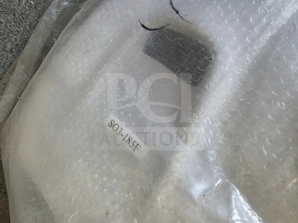 Alero Body Kit wrapped in bubble wrap. Label reads "S03-18SF." Appears new, concealed for protection.