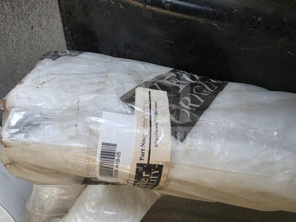 Alero Body Kit in original packaging. Visible barcodes and label indicate part number XXX248405, wrapped in plastic for protection.