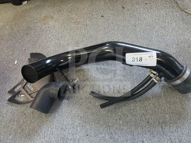 Spyder Cold Air Intake System, black tubing, hoses, clamps, in good condition, auction tag number 318 visible.