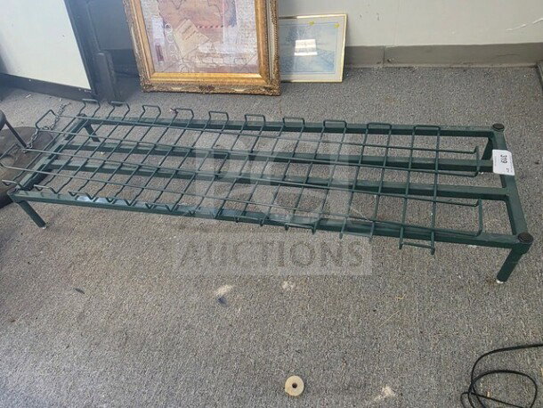 Green metal rack with grid design, sturdy construction, used condition, number tag attached.