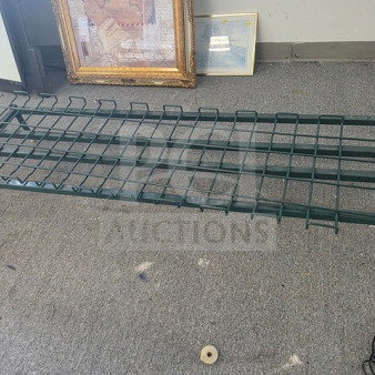 Green metal rack with grid design, sturdy construction, used condition, number tag attached.