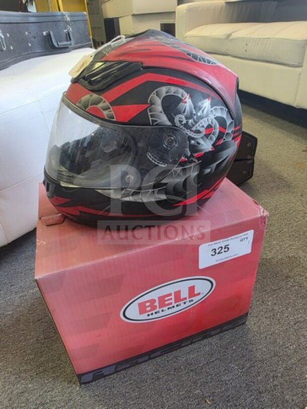 Bell full-face motorcycle helmet, red and black design, on original box. Appears in good condition with tag showing item number 325.