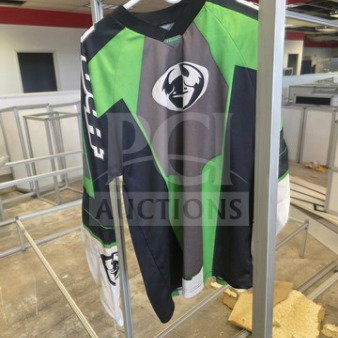 Motocross jersey, green and black with bull logo, long sleeves, hanger display. Good condition.