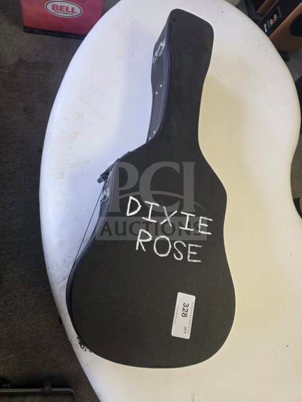 Vintage Cowboy Loye Parlor Guitar in case with "Dixie Rose" label. Sold as is. Case shows signs of wear.