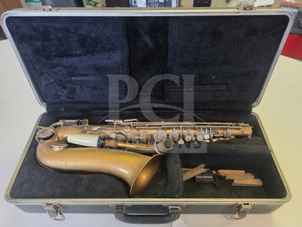 Vintage Selmer Bundy Student Model Alto Saxophone in case. Brass body, complete with keys; sold as is.