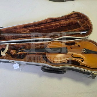 E.R. Pfretzchner violin in a hard case, showing a wooden finish and strings. Sold as is, includes bow and interior storage.