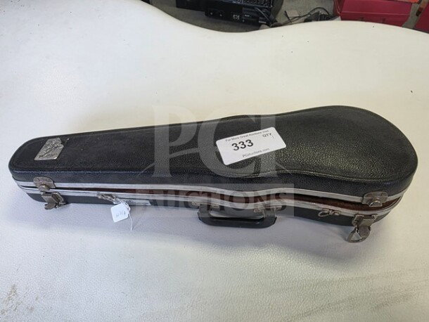 E.R. Pfretzchner violin with a hard case. Case labeled "333." Item sold as is.