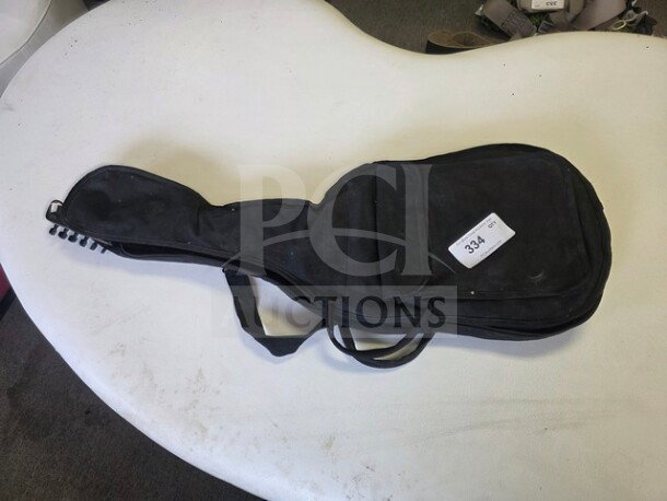 Esteban Midnight Legacy Electric Guitar in soft case, black. Sold as is. Case shows wear with visible auction tag labeled "334".