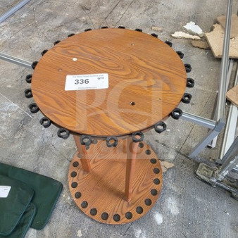 Round wood fishing rod rack with dual circular tiers, multiple rod slots, and a visible auction label marked "336." Good condition.