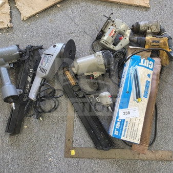 Lot of miscellaneous power tools, including nail guns, drills, and an angle grinder. Condition unknown. Sold as is.