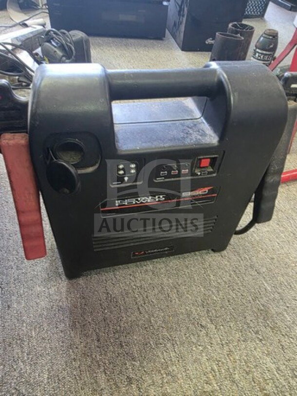 Instant Power 950 Portable Jump Starter, black, with LED indicators, built-in handle, and charging ports; used condition.