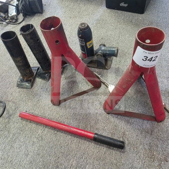 Lot of miscellaneous jack stands in used condition, featuring red and black stands with varying designs. Tag number 342 visible.