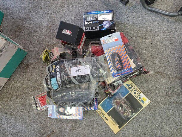 Lot of miscellaneous vehicle lights, cables, and accessories, various brands. Visible packaging includes PIAA and Street Glow. Sold as is.