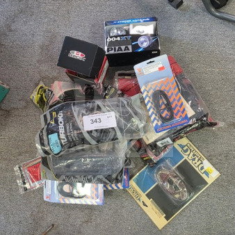 Lot of miscellaneous vehicle lights, cables, and accessories, various brands. Visible packaging includes PIAA and Street Glow. Sold as is.