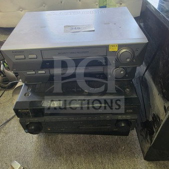 Lot of miscellaneous electronics including a Mitsubishi videocassette recorder, sold as is. Visible wear on devices.