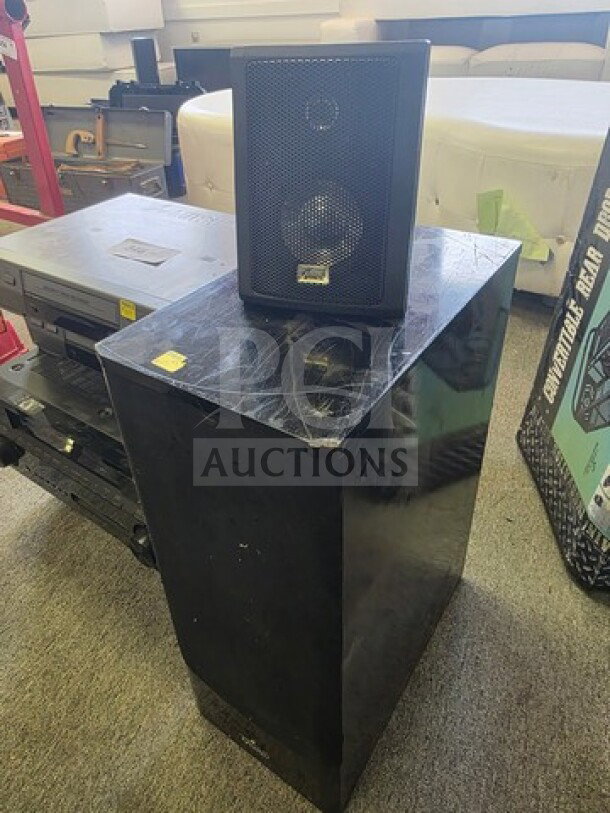 Lot of miscellaneous electronics including large and small speakers, sold as is. Visible wear on surfaces, no brand markings.