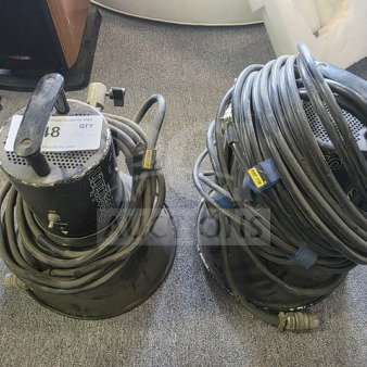 A pair of Speedotron Universal Light Units with cables, showing signs of use, sold as is.