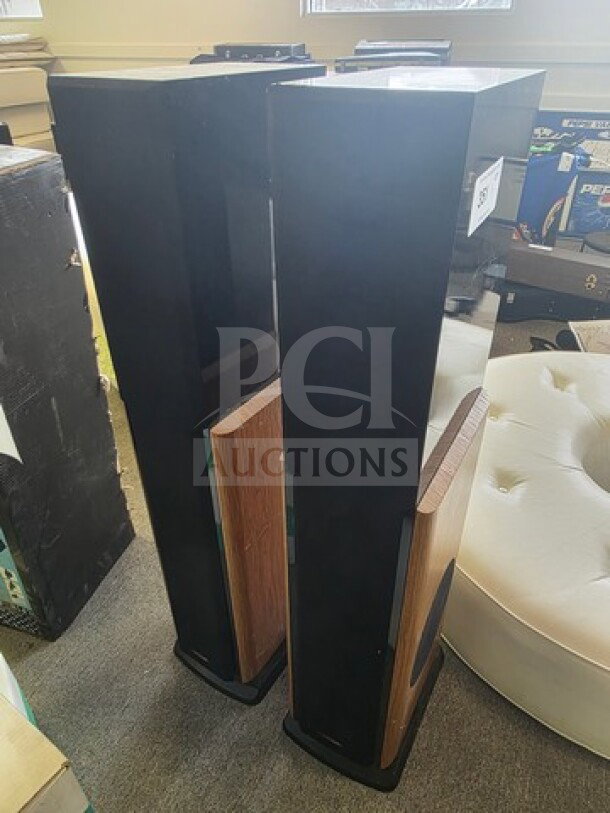 Polk Audio LSi15 Tower Speakers, black and wood finish, sold as is, visible wear on the surface.